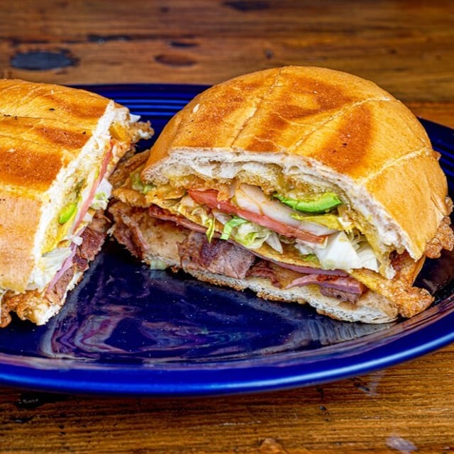 Cubana Torta (Steak, Pork, Ham, Egg) / (Carne, Pierna De Cerdo, Jamón, Huevo).